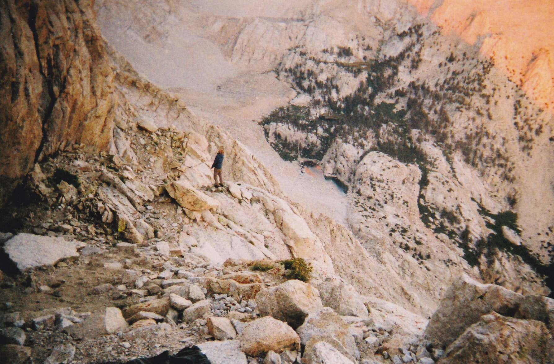 Erik scanning the steep face for the route